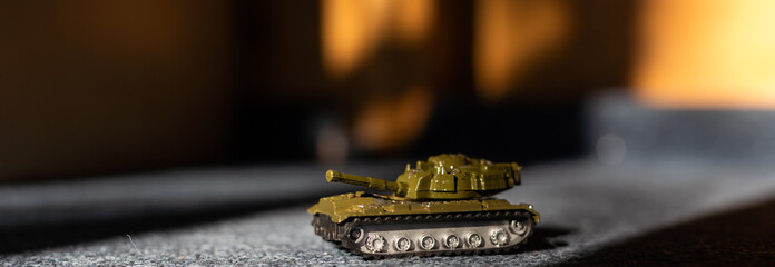 a toy tank fighting vehicle made of plastic, is a type of toy that boys like