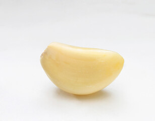 clove of galic on a white background
