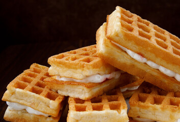 Fresh Viennese waffles with white cream.