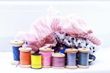 Wooden spools with multicolored threads