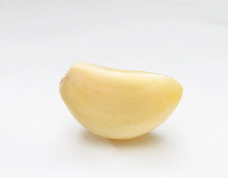 clove of galic on a white background