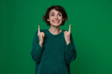 Young white woman laughing and pointing fingers upward