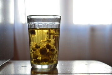 glass of tea with medicinal chamomile