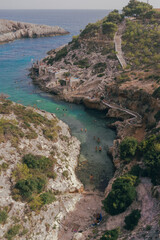 People swimming in a cove in Mediterranean Sea Holiday