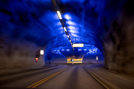 Roundabout in a tunnel in Norway, lighted in blue