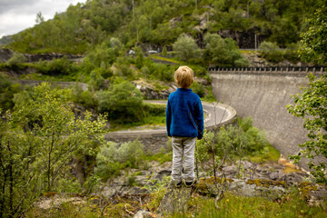 People, children enjoying the amazing views in Norway to fjords, mountains and other beautiful...