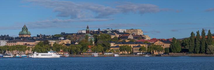 Obraz premium View of roofs, facades and church spires a sunny autumn day in Stockholm