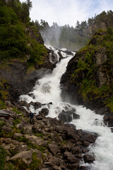 Fototapeta na wymiar Amazing waterfalls near Odda village in Norway, Latefossen, Espelandsfossen, Vidfossen