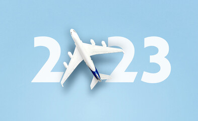 happy new year 2023. year 2023 with toy airplane