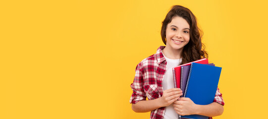 smiling school child ready to study with copybooks, knowledge. Banner of schoolgirl student. School child pupil portrait with copy space.