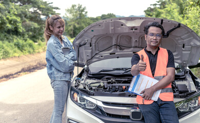 Asian car claim man thumbs up during checking lists of damaged car from accident with woman driver smiling background, Car Insurance concept