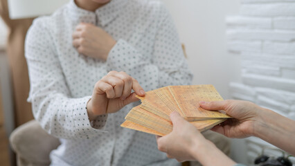 Psychologist uses metaphorical associative cards in a session with a patient. Close up. 