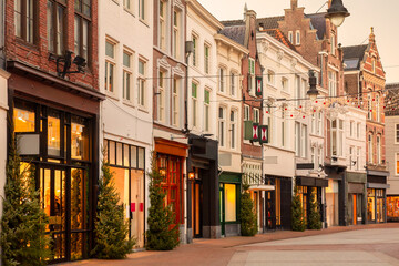 Fototapeta na wymiar The famous Dutch shopping street Hinthamerstraat with december christmas decoration in Den Bosch, The Netherlands