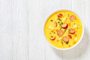 German potato soup with sausages in bowl
