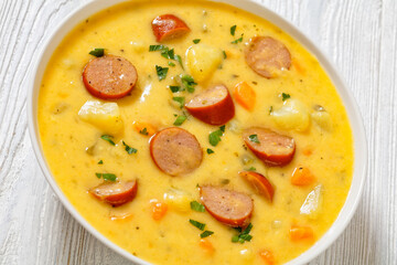 German potato soup with sausages in bowl