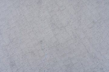 Gray cement wall with square pattern, plaster wall background texture