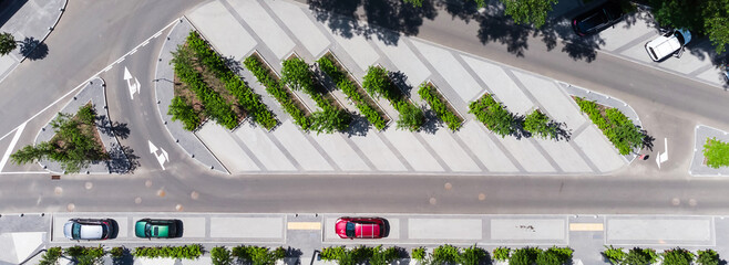 aerial top view of street with parking lot near new residential housing complex