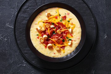 savory creamy pumpkin soup in bowl, top view