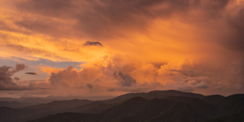 Fototapeta na wymiar Sunset Highlights The Clouds Building Over The Great Smoky Mountains