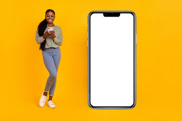 Full size photo of smart millennial brunette lady look telephone wear glasses blouse jeans footwear isolated on yellow background