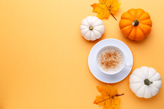 Cup of coffee and pumpkins