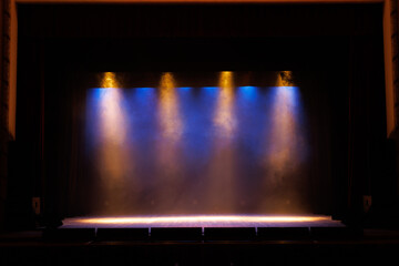 Theatrical scene without actors, scenic light and smoke