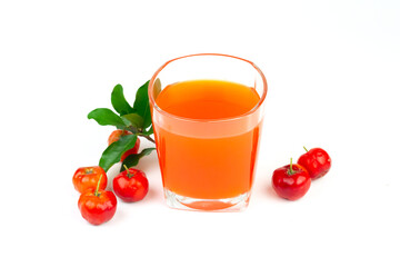Acerola or barbados cherry juice in glass with fresh acerola cherry fruits isolated on white...