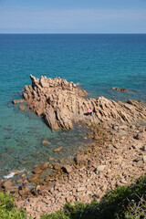 The little beach of Su Sirboni has red surfacing rocks - Sardinia - italy