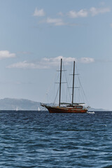 Fototapeta premium view of wooden ship in the coast of cagliari shoreline - poetto beach.