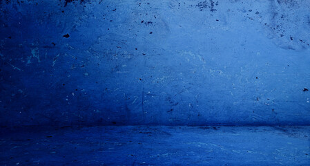 grungy blue rustic concrete wall and floor use as backdrop for product displayed for advertisement. old stained room, background, studio, interior, space.