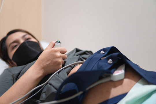 Pregnant people use Fetal Monitor on hospital for uterine contraction recorder. 