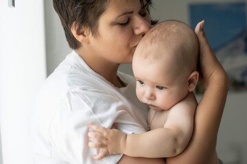 picture of happy mother with baby in hands