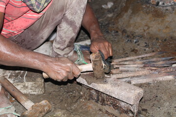 Blacksmith worker with hammer