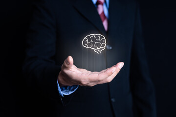 business man hand holding visual brain