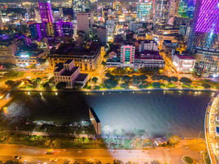 Aerial panoramic cityscape view of Ho Chi Minh city and Saigon river, Vietnam. Center of heart business at downtown with buildings and towers.