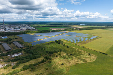 aerial view on farm field of solar panels. Renewable solar energy.