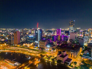 Fototapeta na wymiar Aerial panoramic cityscape view of Ho Chi Minh city and Saigon river, Vietnam. Center of heart business at downtown with buildings and towers.