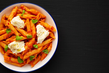 Homemade Penne Alla Vodka With Bacon, Cheese and Basil. Copy space.