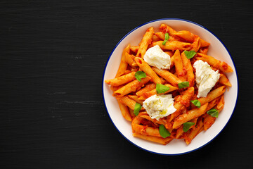 Homemade Penne Alla Vodka With Bacon, Cheese and Basil. Space for text.