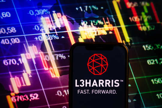 KONSKIE, POLAND - September 04, 2022: Smartphone displaying logo of L3Harris Technologies company on stock exchange chart background