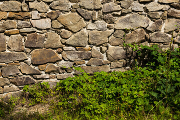 Texture of a stone wall. Old castle stone wall texture background. Stone wall as a background or texture. Part of a stone wall, for background or texture.
