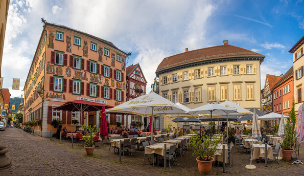 Eberbach, Germany: July, 29. 2022: Alter Markt (trans. Old market) in the center of the old town of Eberbach at the Neckar river with outdoor gastronomy on a summer evening