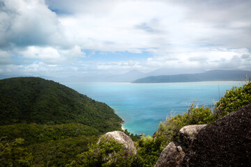 Fototapeta na wymiar A beautiful tropical paradise island, Fitzroy Island in Queensland, Australia, with lush green hills and turquoise water, located in the Great Barrier Reef. 