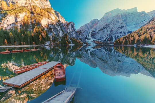 Boats on the Braies Lake ( Pragser Wildsee ) in Dolomites mountains, Sudtirol, Italy.  Alps nature landscape
