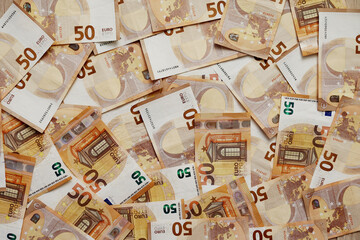 background of banknotes 50 euros beautifully laid out. Euro money. European Union banking, financial savings. concept of economy. banks, money, wealth, finance and business success.