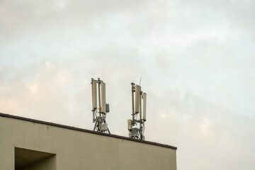New GSM antennas on the roof of a building for transmitting a 5g signal are dangerous to health. Radiation pollution of the environment through cell towers. The threat of extinction of the population