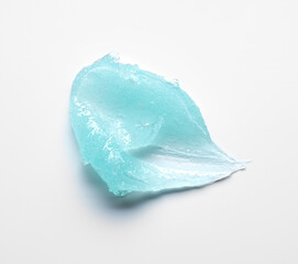 Brushes of light blue gel on a light background.