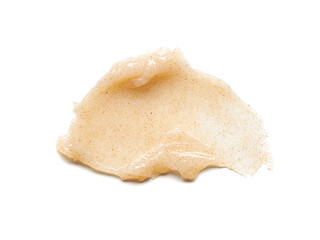 Light beige smear of creamy body scrub isolated on white background.