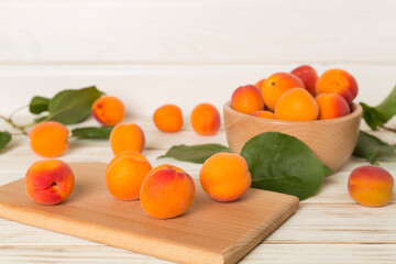 Composition with ripe apricots on wooden background, top view