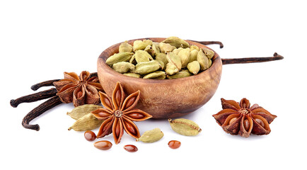 Cardamon, anise, vanilla  in wooden bowl isolated on white background. Spices isolated.
